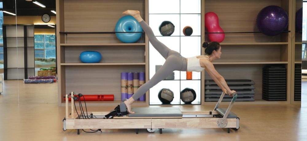 Balance corporelle en bois pliant Pilates réformateur de lit de base